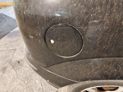 TAPA EXTERIOR COMBUSTIBLE