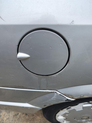 TAPA EXTERIOR COMBUSTIBLE