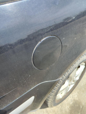 TAPA EXTERIOR COMBUSTIBLE