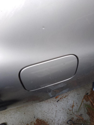 TAPA EXTERIOR COMBUSTIBLE