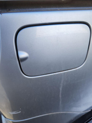 TAPA EXTERIOR COMBUSTIBLE