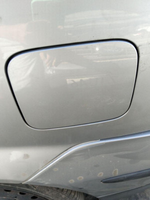 TAPA EXTERIOR COMBUSTIBLE