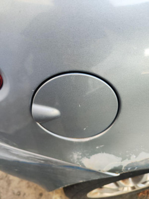 TAPA EXTERIOR COMBUSTIBLE