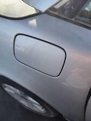 TAPA EXTERIOR COMBUSTIBLE