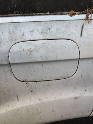 TAPA EXTERIOR COMBUSTIBLE