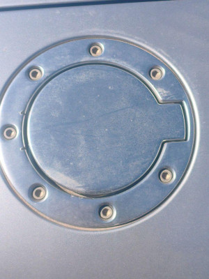 TAPA EXTERIOR COMBUSTIBLE