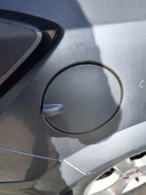 TAPA EXTERIOR COMBUSTIBLE