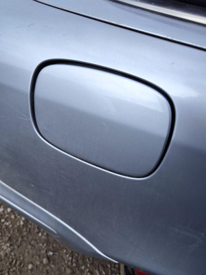 TAPA EXTERIOR COMBUSTIBLE